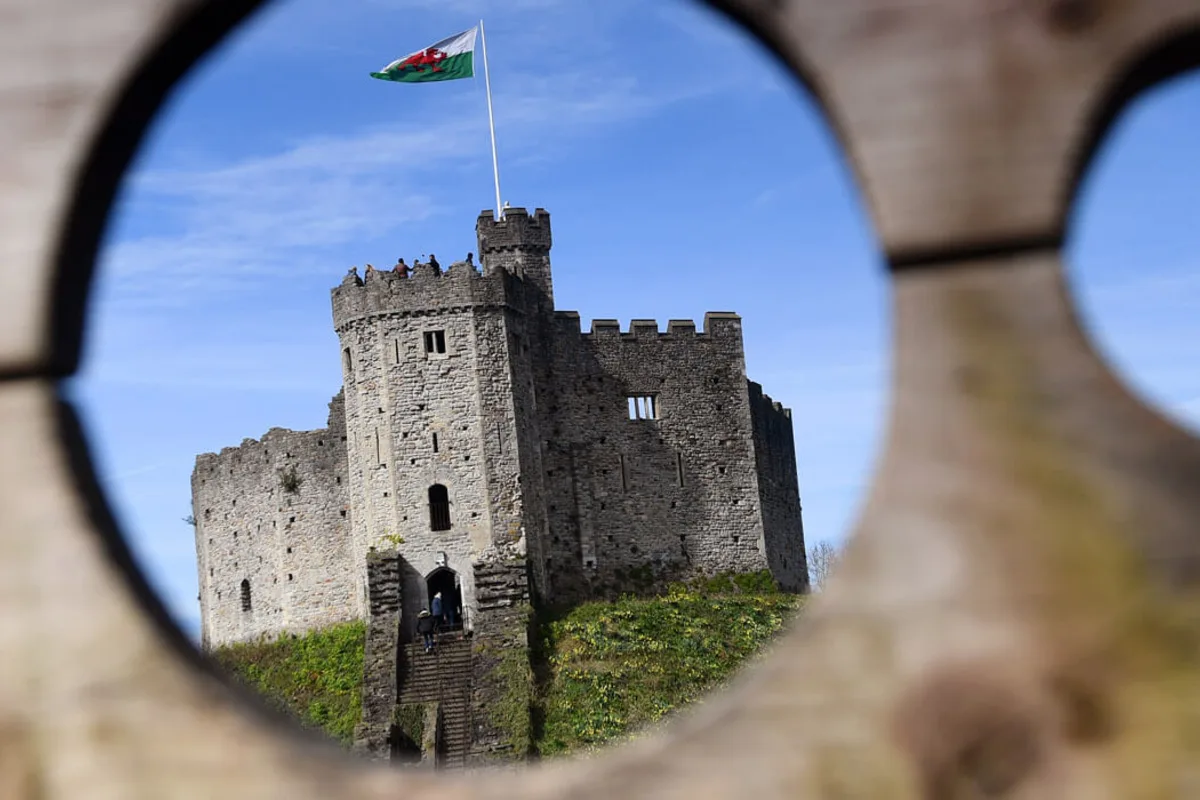 The Norman Keep at Cardiff Castle viewed through a stone opening