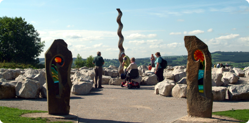 Visitors using the accessible outdoor route at Crich Tramway Village