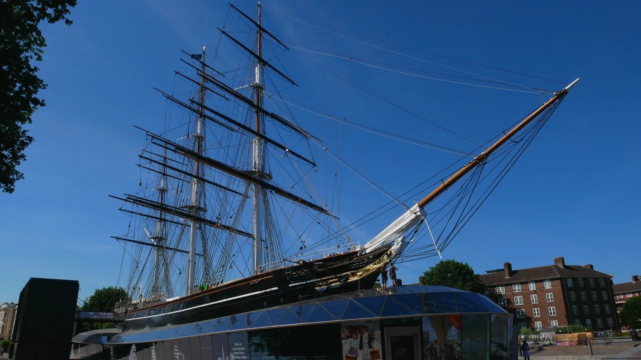 Cutty Sark displayed above its glass-roofed dry dock in Greenwich