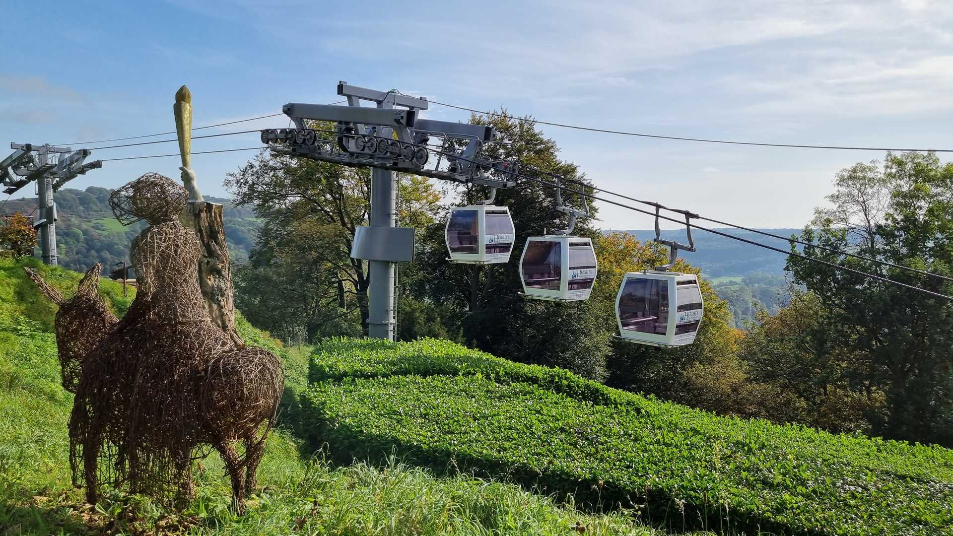 Cable cars travelling above the steep wooded Heights of Abraham estate