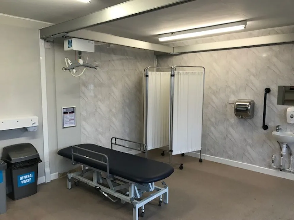 Lightwater Valley Changing Places room with an adult changing bench, hoist and privacy screen