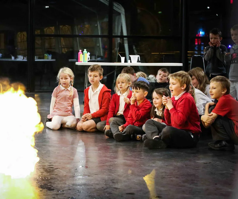 Children watching a bright science demonstration inside Magna Science Adventure Centre