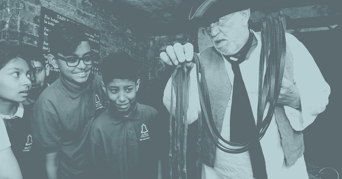 Children taking part in a historical learning activity at the National Justice Museum