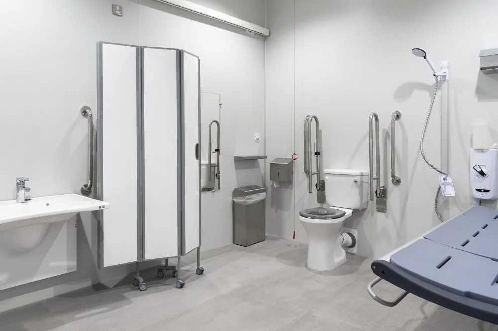 Changing Places toilet at the Science Museum with a changing bench, hoist and grab rails