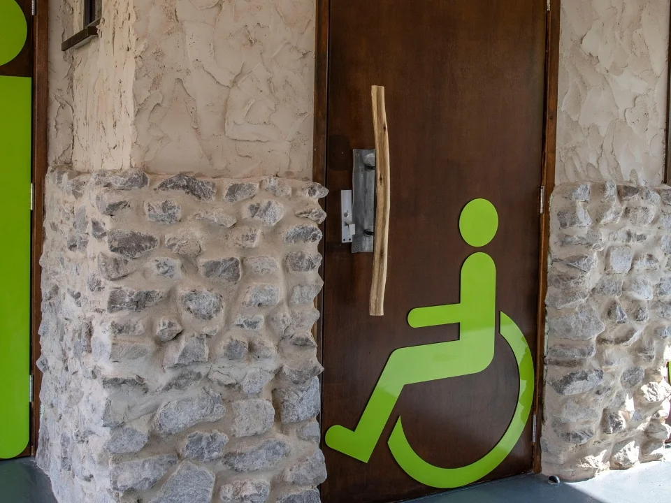 An accessible toilet entrance at West Midlands Safari Park, marked with a wheelchair symbol